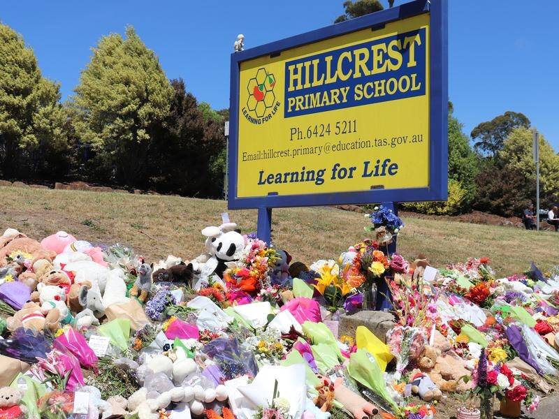 Flowers and tributes have been left outside Hillcrest Primary School in Devonport, Tasmania.