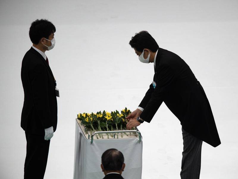 Japanese Prime Minister Shinzo Abe has attended an official ceremony for war dead.