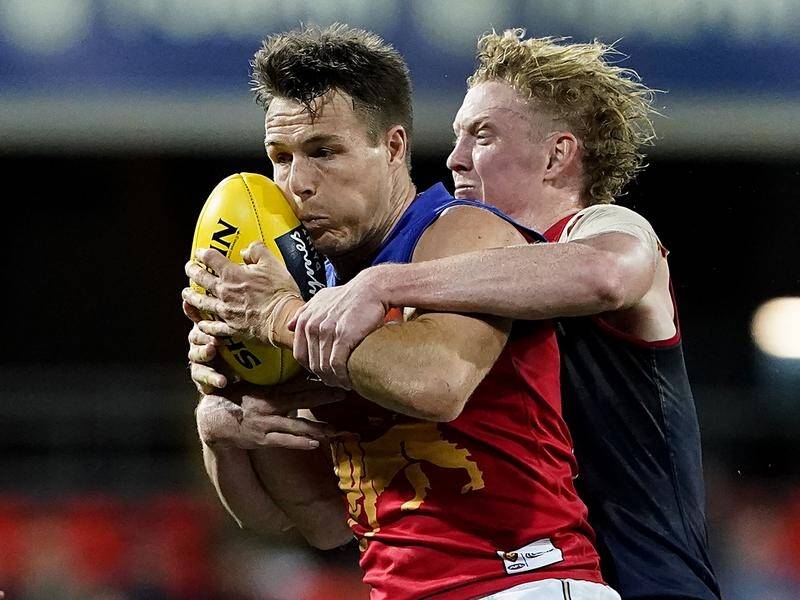 Melbourne's Clayton Oliver, right, faces a ban for striking during Friday's loss to Port Adelaide.