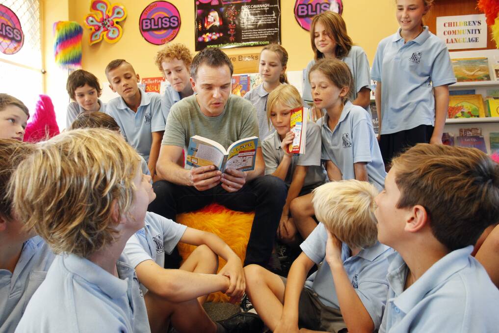 FANTASTIC REACTION: Author Tristan Bancks reads to year 5 and 6 opportunity class students from Tighes Hill Public School. Picture: Max Mason-Hubers