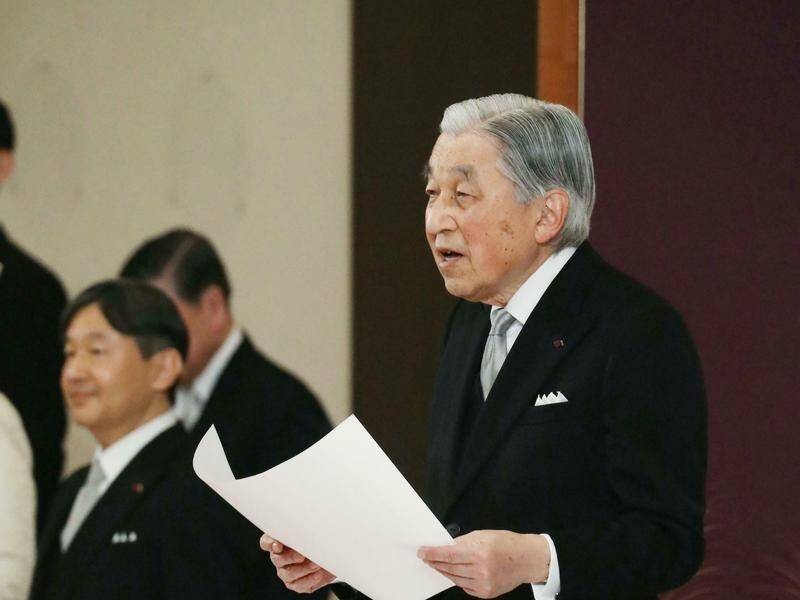 Japanese Emperor Akihito gives a final farewell to the public during his abdication ceremony.