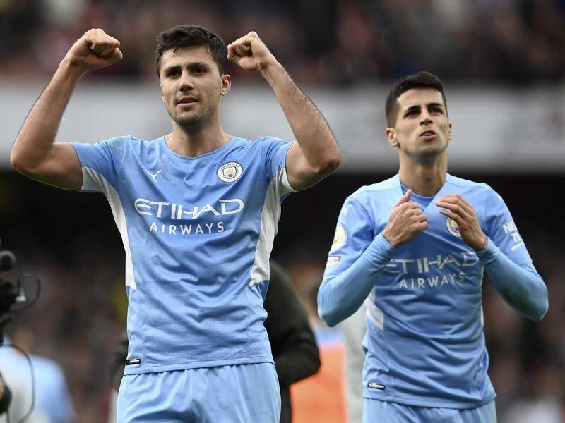Rodri (l) has signed a three-year contract extension with EPL champions Manchester City.