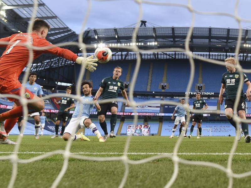 Manchester City's David Silva scores his team's fourth goal against Burnley in the EPL on Monday.