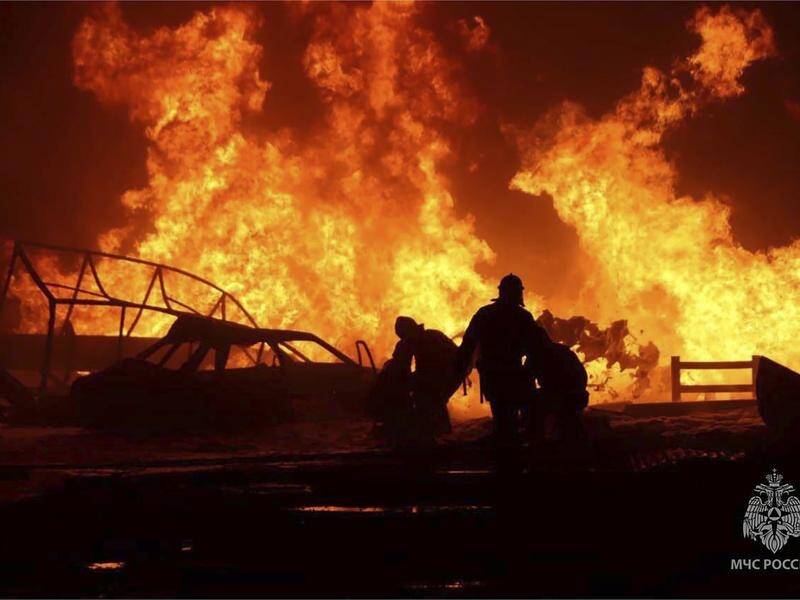 A fire at a petrol station in Dagestan, Russia, has killed at least 35 people. (AP)