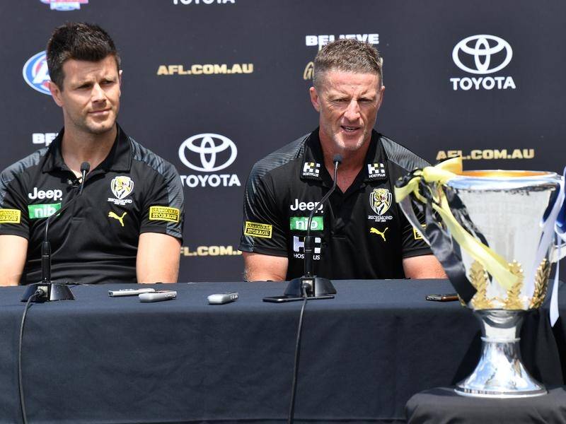 Richmond coach Damien Hardwick (r) is one win away from a third premiership in four years.