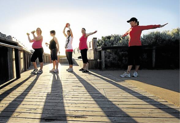 Parenting  magazine.  Pic shows pregnant mums going through some exercise routines under the instruction of  Louise Richards - at far right, at the Logans beach viewing platform. Mums are from left   Kelli Vertigan, Rebecca Wickenton, Melissa Lenehan and Julie Shiells.  080312GW01 SPECIALX 01031814