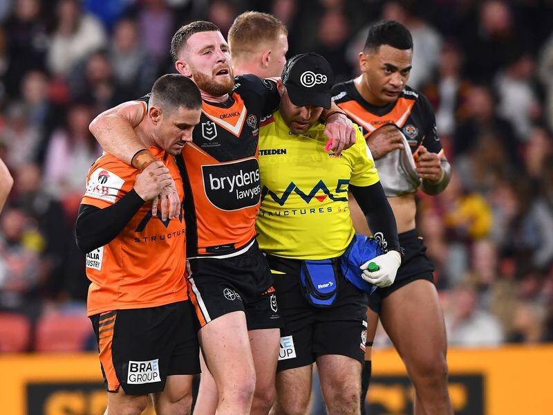 Wests Tigers fear Jackson Hastings' season may be over after sustaining an injury against Brisbane. (Jono Searle/AAP PHOTOS)