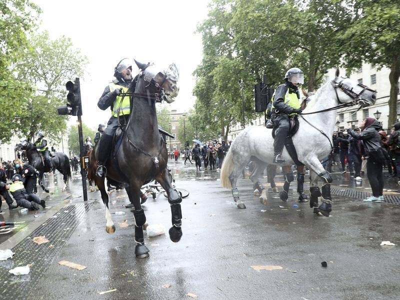 British anti-racism protesters have clashed with mounted police in London.