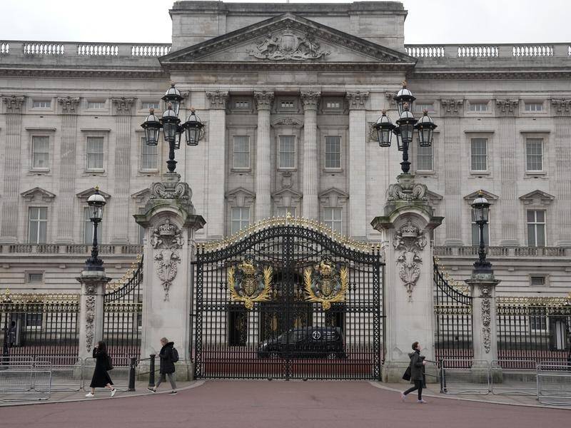 A man is in custody after a car crashed into the gates of Buckingham Palace, British police say. (AP PHOTO)
