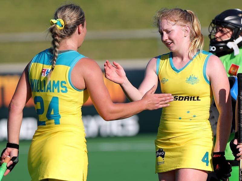 Amy Lawton (R) has been promoted to a permanent spot in Australia's 27-strong women's hockey squad.