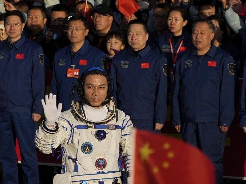 Former Chinese air force pilot Tang Hongbo is leading a six-month mission to the space station. (AP PHOTO)