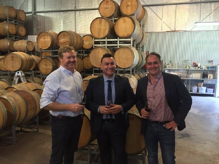 NSW Minister for Small Business John Barilaro, centre, with Glandore general manager Nick Flanagan, left, and proprietor-winemaker Duane Roy.