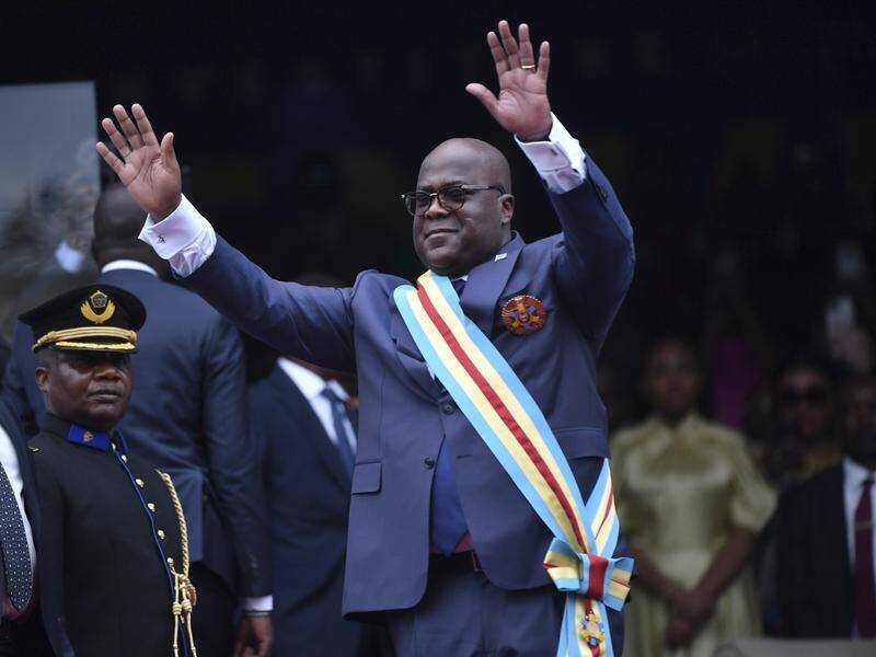 Congo's President Felix Tshisekedi waves as he is sworn in for a second term. (AP PHOTO)