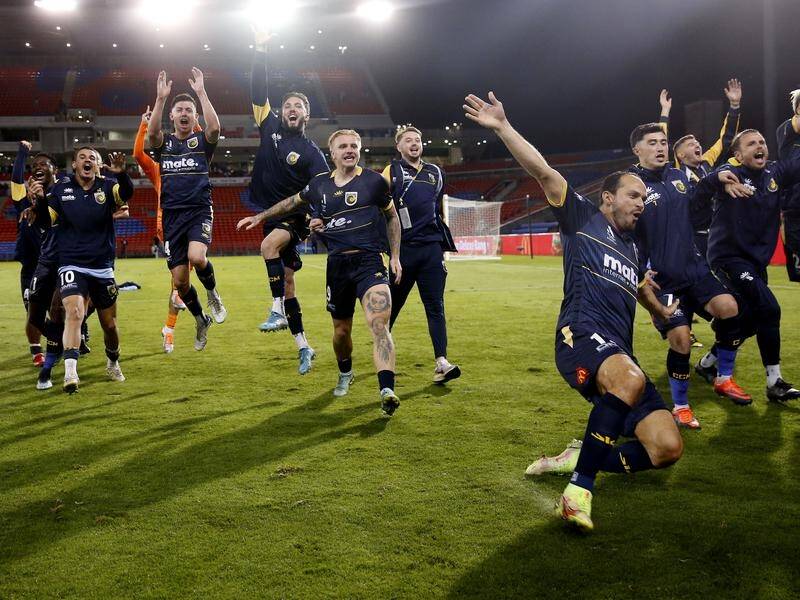 Central Coast Mariners players celebrate their important ALM derby win over Newcastle Jets.