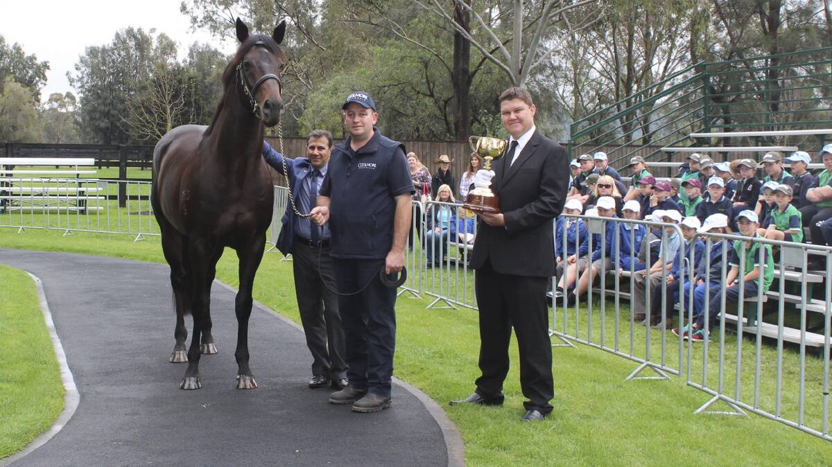 Former Melbourne Cup winning jockey John Marshall visits Coolmore stud with the  Melbourne Cup.