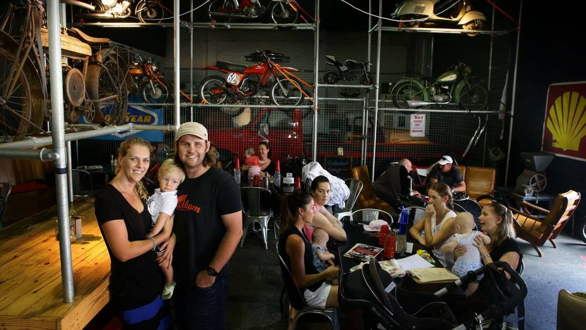 Wickham Motorcycle Cafe owners Odette and Luke Tonkin with their son Bastion. Picture: Peter Stoop
