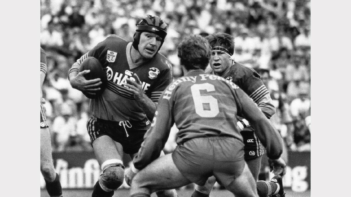 Newcastle Knights in 1988.  Newcastle Knights vs Parramatta Eels. Rob Tew prepares to tackle Peter Wynn in the Knights' first game in 1988. 
