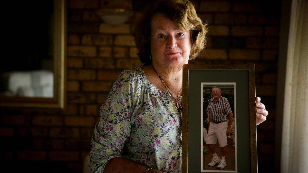 Joy Callinan  with a photo of her husband John Callinan, who worked at the Hamilton gasworks. Picture: Ryan Osland
