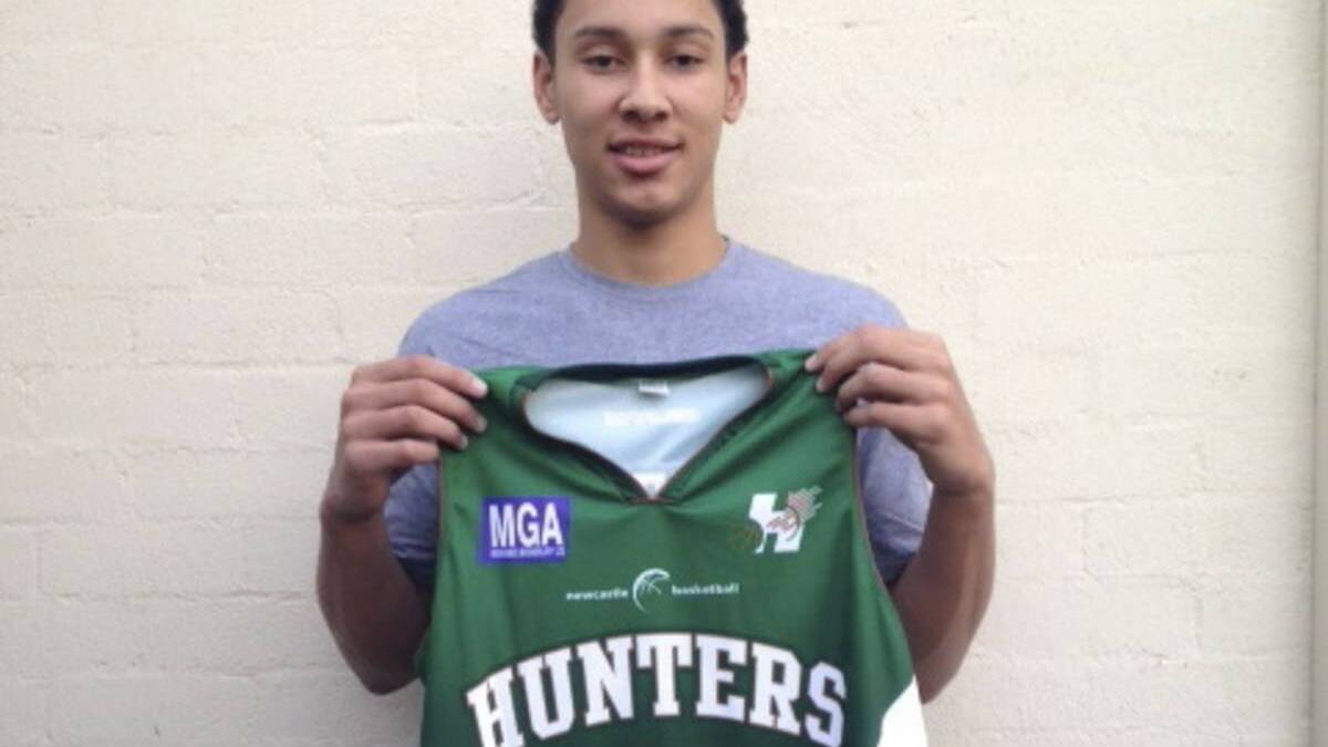HOT PROSPECT: Ben Simmons with his Newcastle Hunters singlet on Monday.
