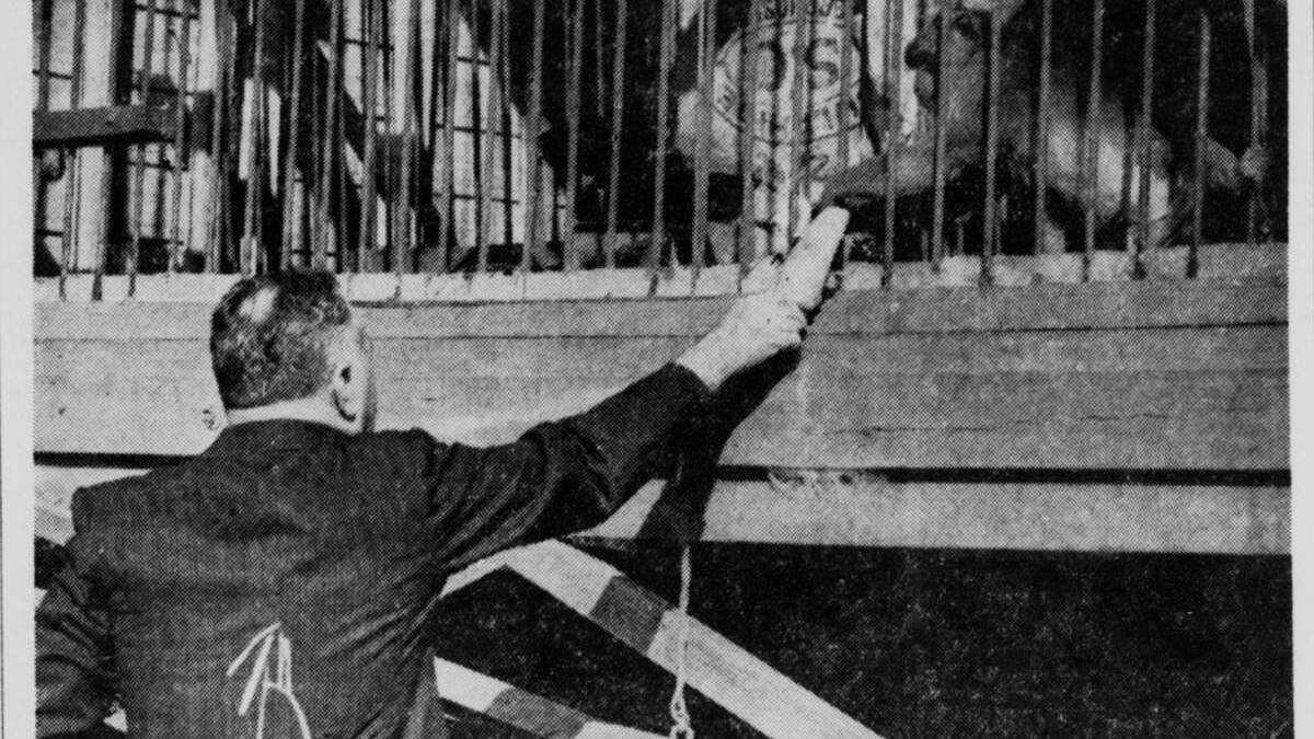 Dr Henry Leighton-Jones feeding a monkey at his Eraring home in 1939. 