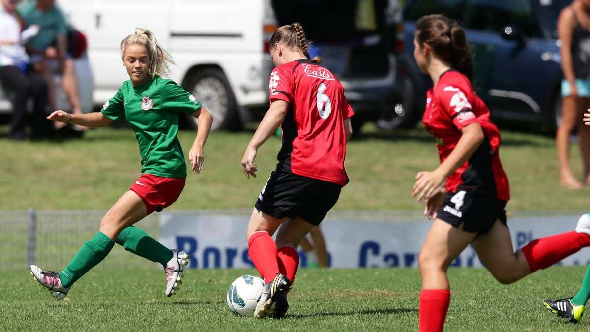 Rhali Dobson, left, in the Herald Women's Premier League opening round between Thornton Redbacks and Adamstown Rosebuds last month. Picture Dean Osland 
