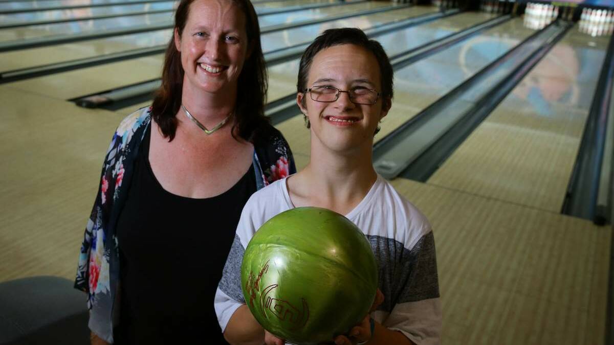SEEKING FRIENDS: Lisa Taylor with  son Brandon at SuperStrike bowling alley at Warners Bay.  Picture: Peter Stoop