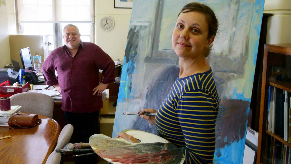 HONOURED: Rachel Milne works on a portrait of Maitland regional art gallery curator Joe Eisenberg.  Picture: Peter Stoop