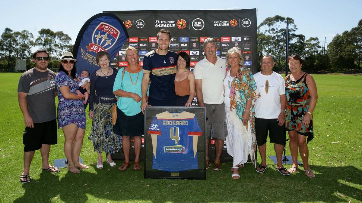 Nigel Boogaard and wife Kerryn Boogaard are flanked by family members after Nigel was named Jets captain on Monday. Picture: Jonathan Carroll