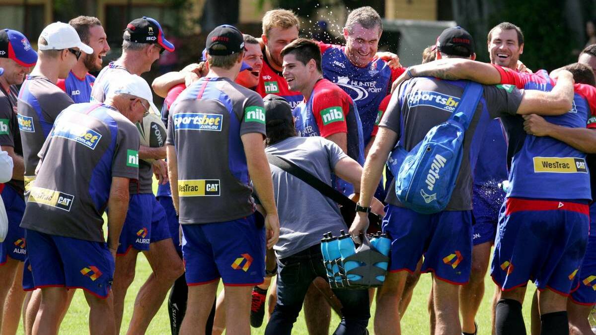 DEBUT: Jake Mamo, centre, is welcomed into the Knights first-grade team at training on Thursday.  Picture: Brock Perks