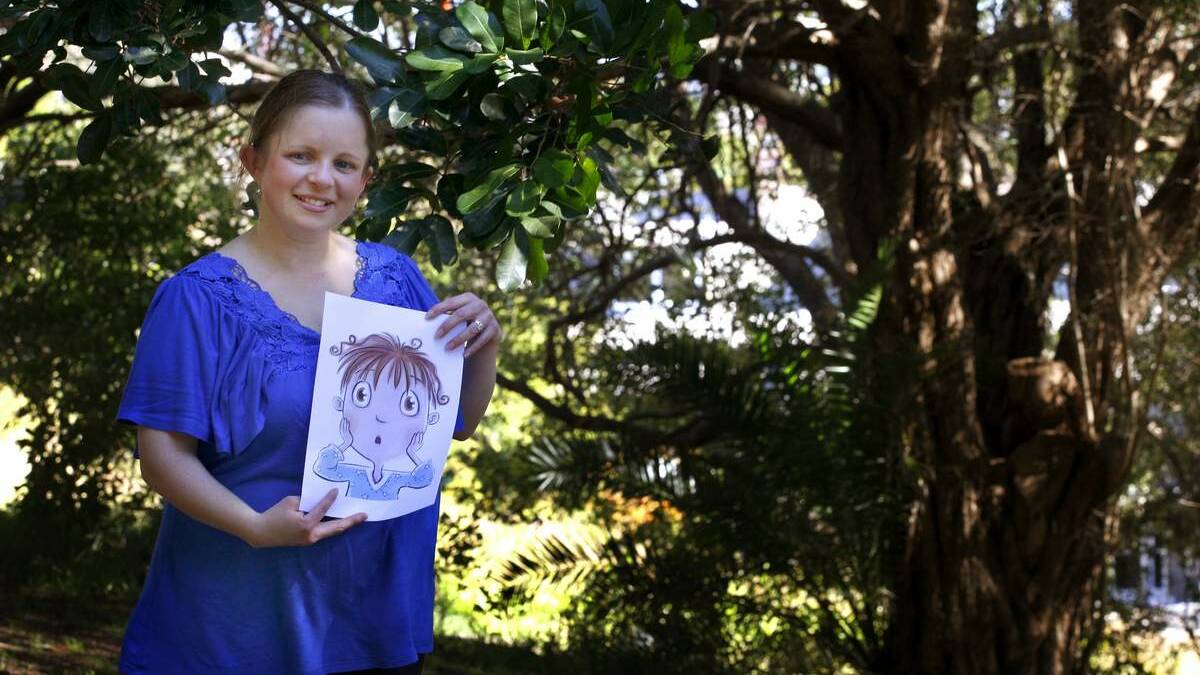 Author Renee Price with an illustration from her upcoming book "Digby's Moon Mission". Picture by Brock Perks. 