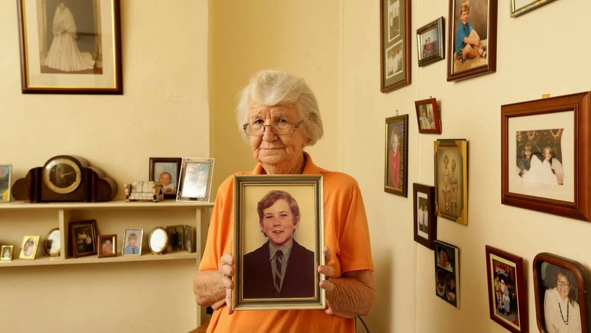 HEARTBREAK: Audrey Nash, with a photo of her son, Andrew, who took his own life at their Hamilton home in 1974, aged 13, a victim of abuse. Picture: Max Mason-Hubers