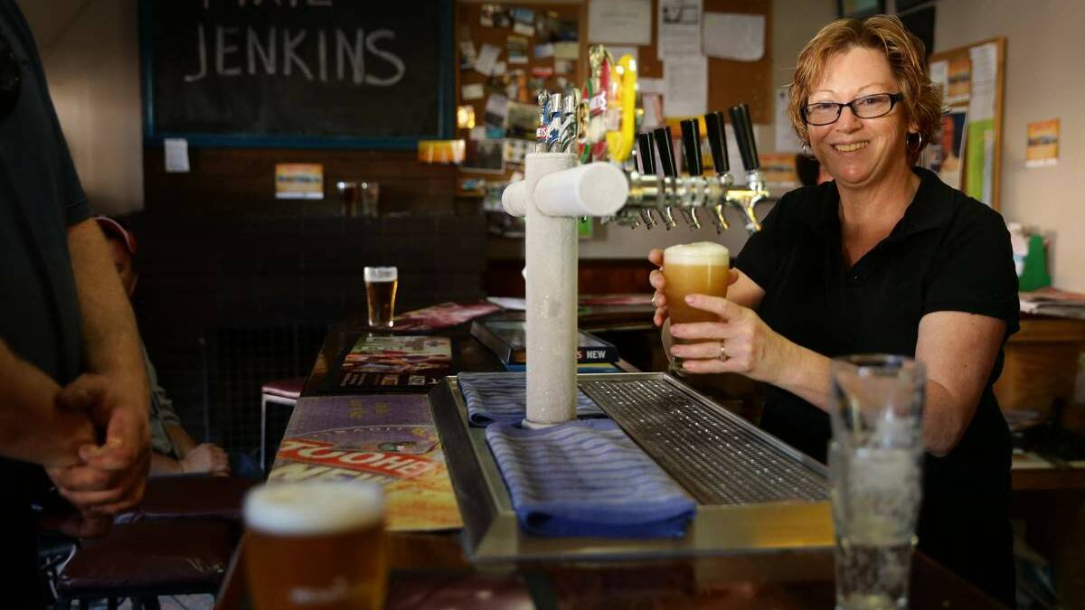 Monique Barrowcliff, owner of Merriwa’s Royal Hotel, serves in the bar. Pictures: Marina Neil
