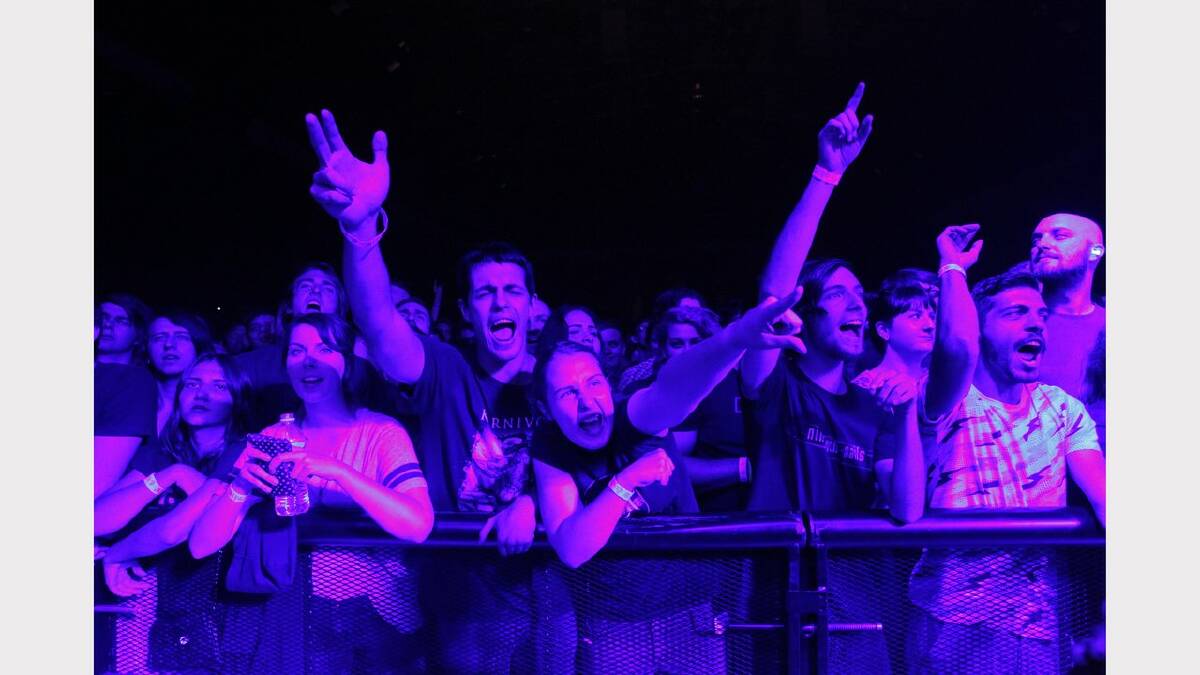 The crowd cheering for Nine Inch Nails, on stage at the Newcastle Entertainment Centre. NIN played with Queens of the Stone Age. Picture Max Mason-Hubers