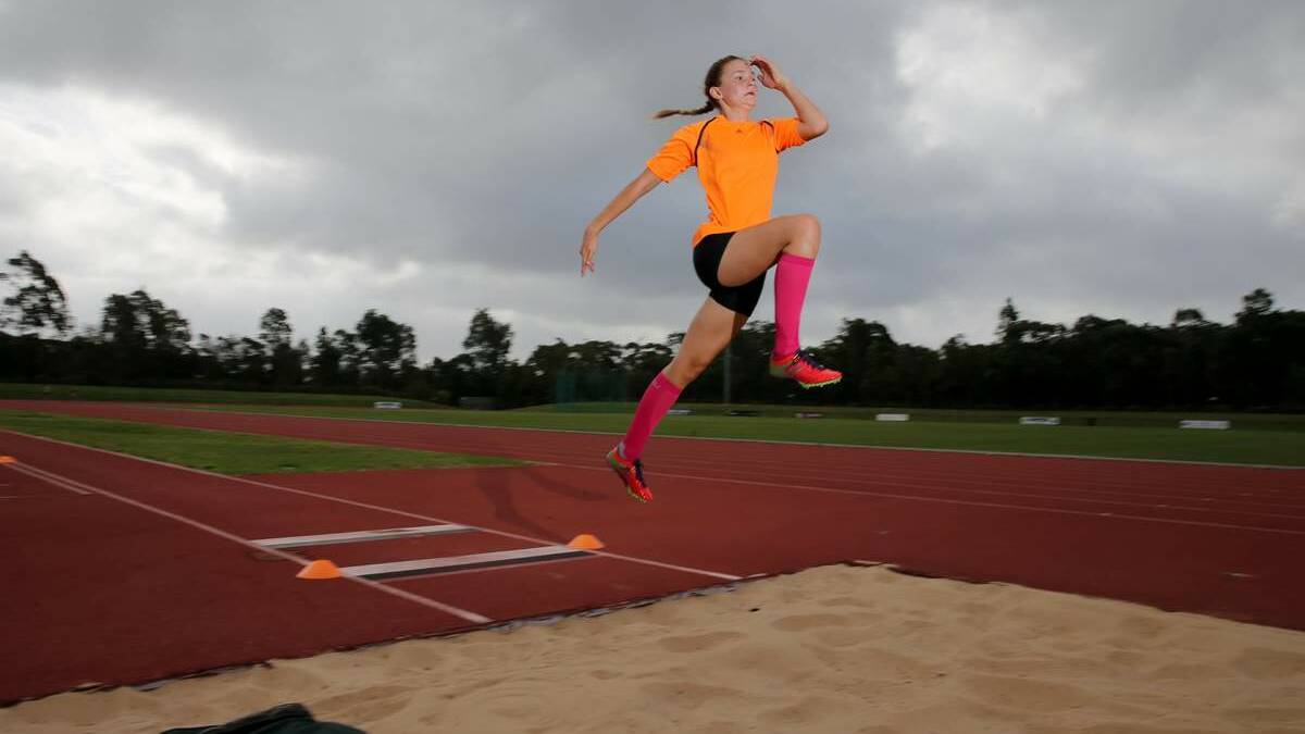 Multi-talented Erin Cleaver training in the long jump pit at Hunter Sports Centre.Picture: Ryan Osland