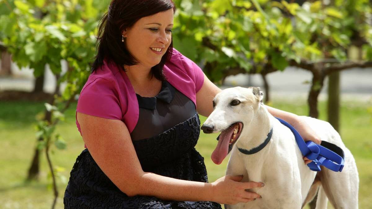 MOTIVATED: Jaelea Skehan with her retired greyhound Bud.  Pictures: Jonathan Carroll