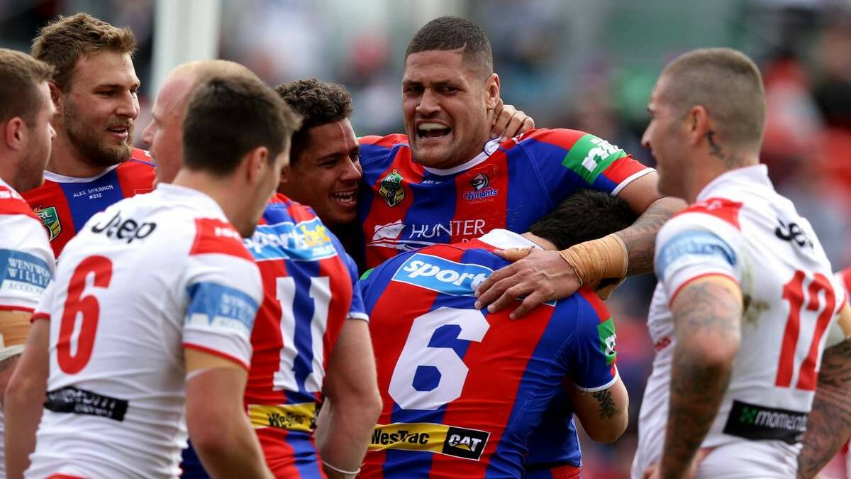 OUT WITH A BANG: The Knights celebrate after a Jarrod Mullen try in their 40-10 win over the Dragons at Hunter Stadium on Sunday. Pic: Jonathan Carroll
