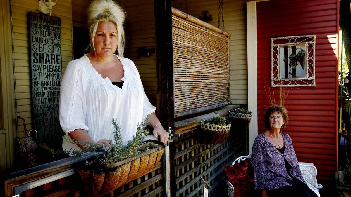 CAUGHT: Michelle Matheson, with her mother, Delys, has been battling to keep her home.  Picture: Darren Pateman