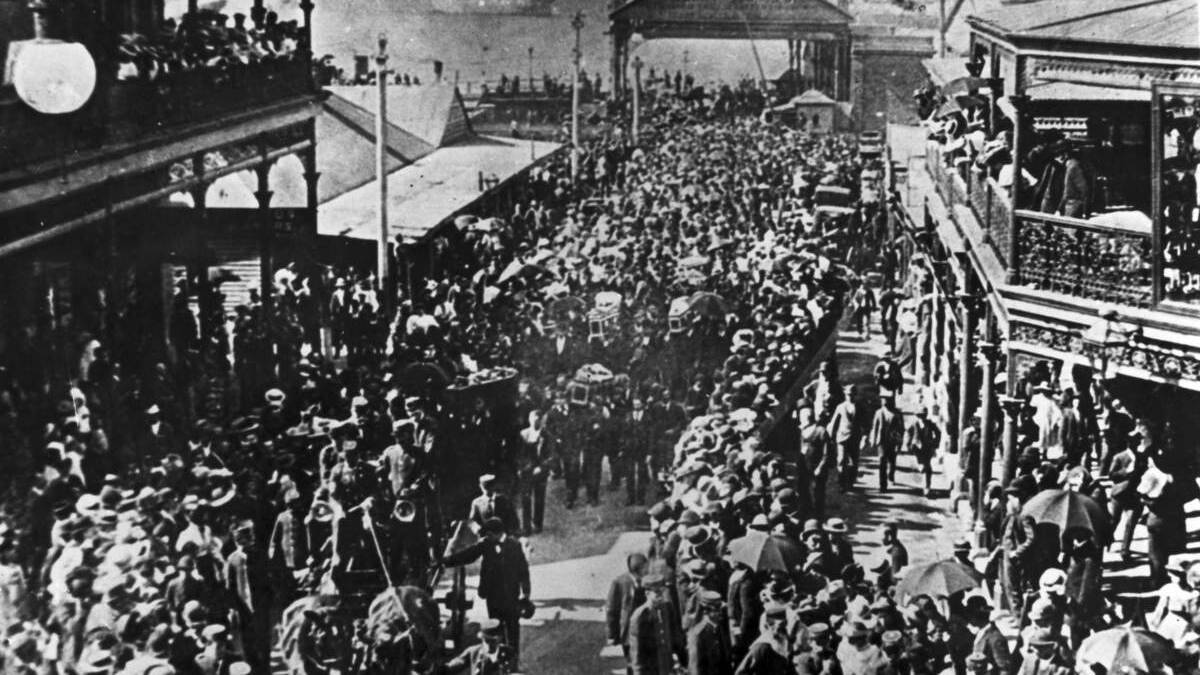 GRIEF: The funeral of miners who died in the 1896 Stockton Pit  disaster,  in Market Street after the coffins landed at the wharf.