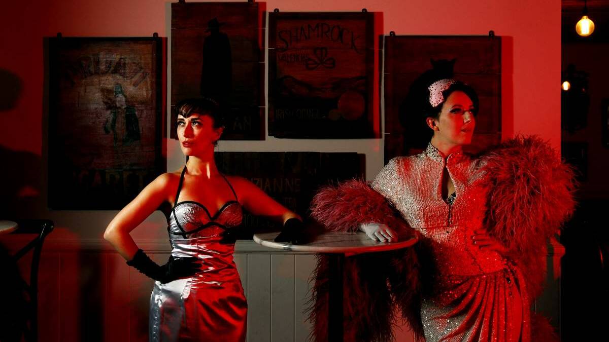 SCARLET WOMEN: Touring performers Miss La Vida and Bella de Jac pose at Bar Petite in Newcastle yesterday.     Picture: Simone De Peak
