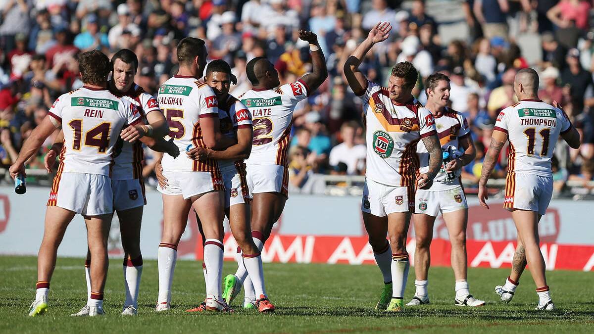 Newcastle Knights Akuila Uate and Tariq Sims of Country high five each other after winning the City v Country Origin match at McDonalds Park on May 3, 2015 in Wagga Wagga, Australia. (Photo by Stefan Postles/Getty Images)

