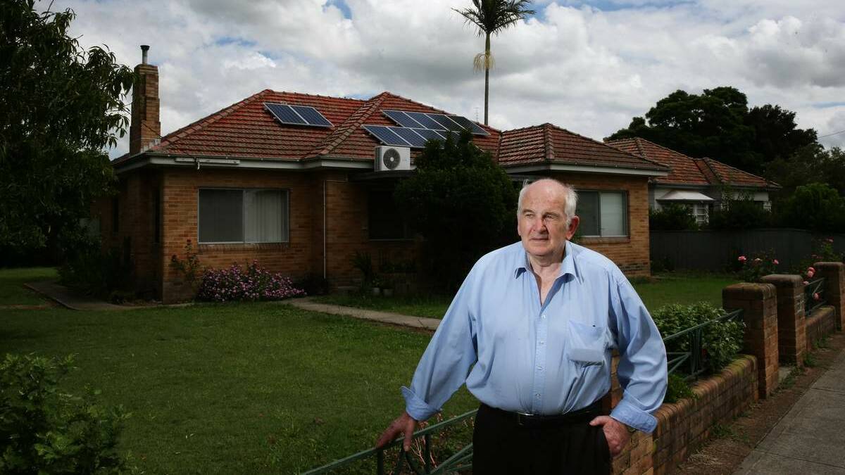 DISASTER: Peter Bogan in front of his family’s former house in Carrington Street, Maitland.  Picture:  Peter Stoop