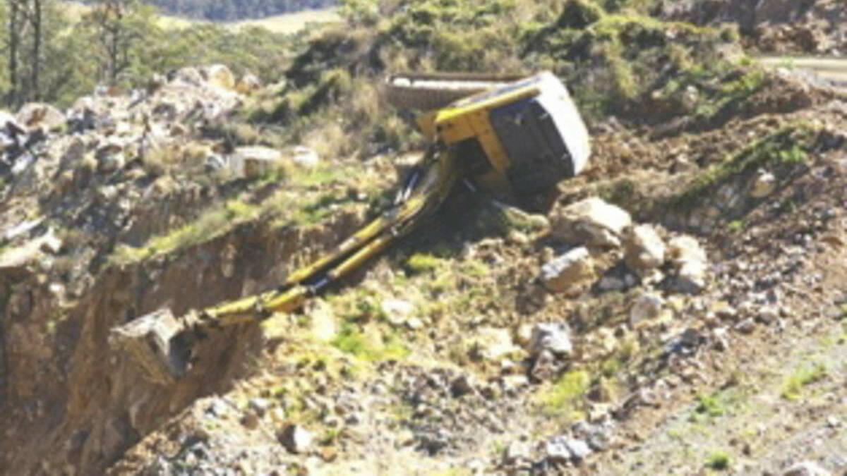 STEEP DROP: The excavator that Ryan Messenger was operating rests on the hillside.