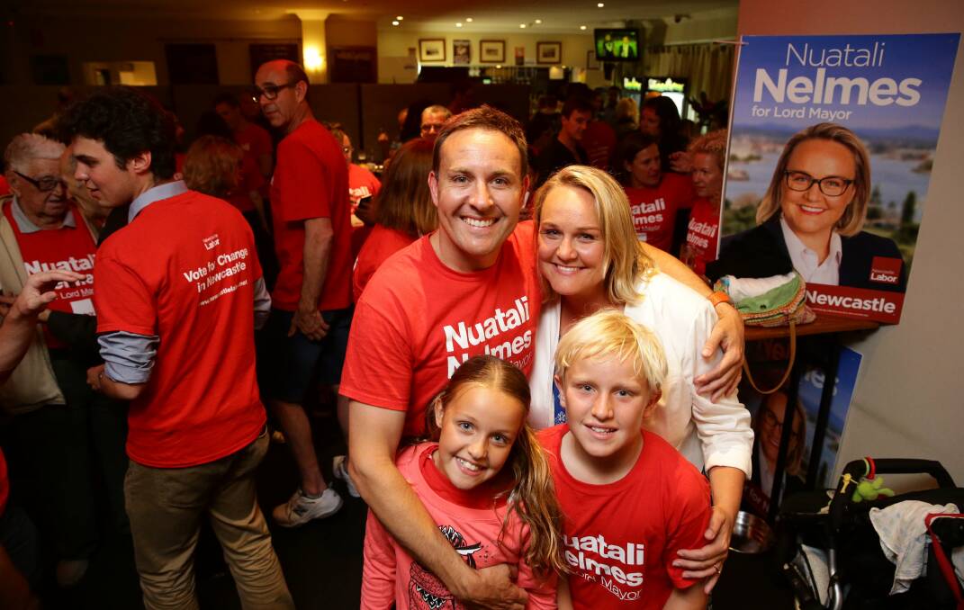 Another win for Labor: Nuatali Nelmes with her husband Stuart and their children Stella and Archie at the Seven Seas hotel in Carrington. Picture: Max-Mason Hubers