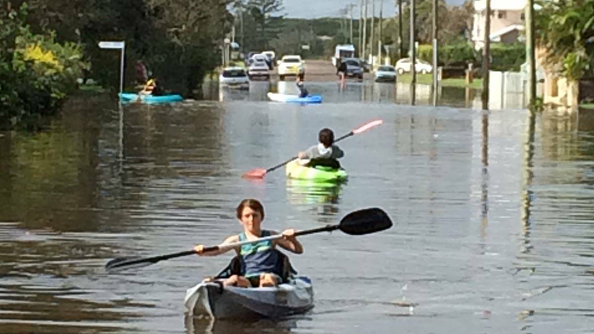 Zac buehler-Craig, 11, makes the most of flooded Coogee Ave, North Entrance. Picture: Joanne McCarthy