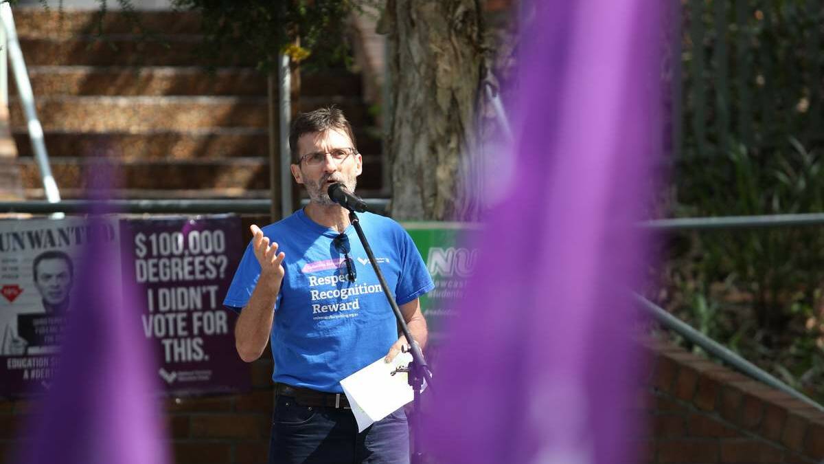  NTEU president To Griffiths speaking to the crowd. Pic: Max Mason-Hubers
