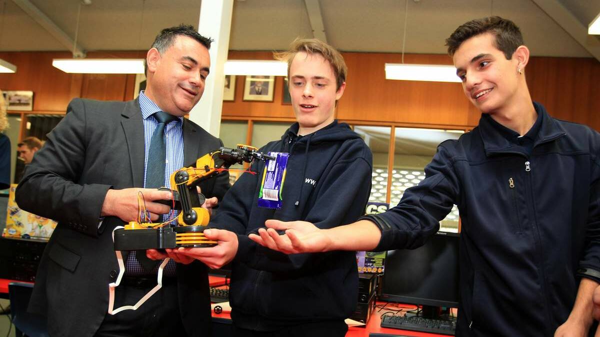 Minister for Regional Development John Barilaro with Mason Mangobski and Tyler Smith at West Wallsend High School. Picture: Phil Hearne
