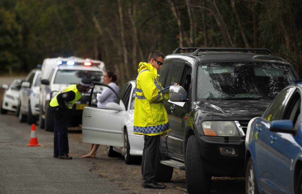 NSW police interview drivers stopped at a checkpoint on Batar Creek Road on the outskirts of Kendall. NSW police are questioning people using the road at approximately the same time 3 year old William Tyrell went missing.
