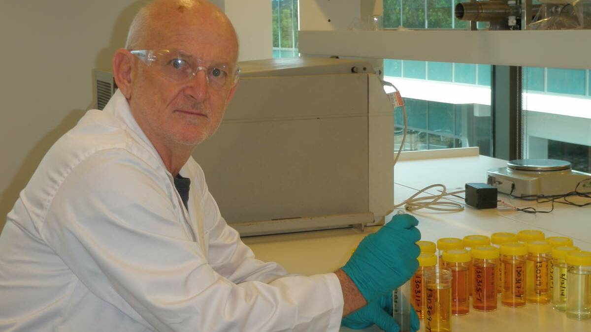 Macquarie University researcher Anthony Morrison preparing black slag leachate samples for chemical analysis in the laboratory.
