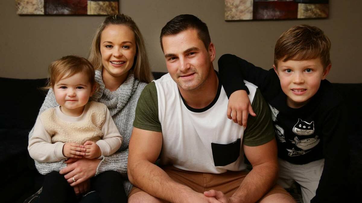  Former Knights (now Titans) hooker Chad Redman with his fiancee Shelly and kids  Harlow on left and Cohen on right. Pic: Peter Stoop