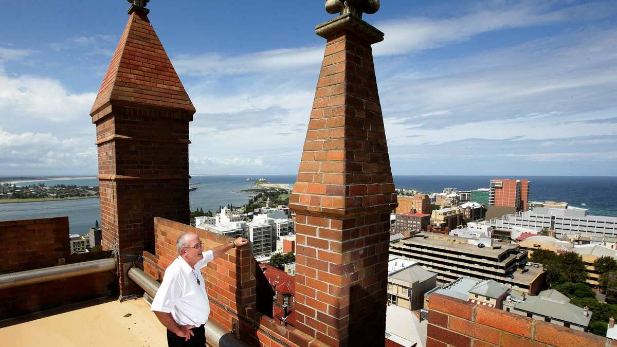 Reverend Stephen Williams on top of the tower on Christ Church Cathedral Newcastle. Pic: Peter Stoop